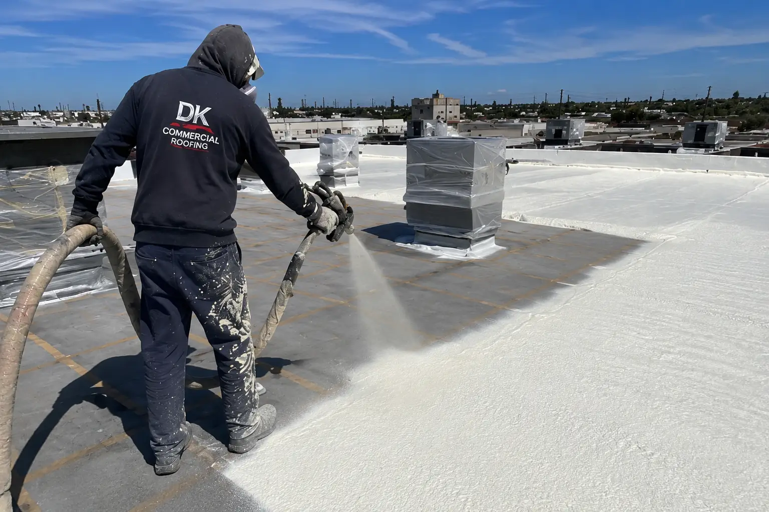 Spray foam roofing being applied to a Los Angeles commercial roof